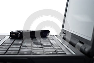 Mobile phone on a laptop
