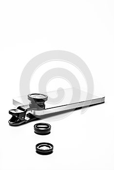 Mobile Phone laying with Clip on Photo Camera Lenses