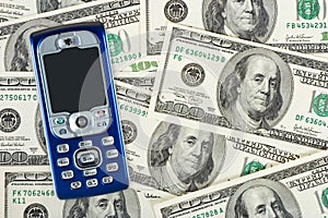 Mobile phone on money background