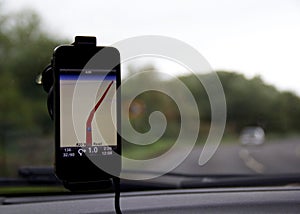 Mobile phone navigation map attached to car windscreen