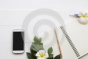 Mobile phone ,notebook of student writing note for study