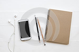 Mobile phone ,notebook of student writing note for study