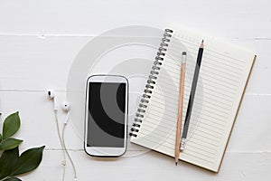 Mobile phone ,notebook of student writing note for study