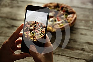 Mobile phone pizza food picture.