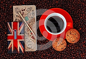 Mobile Phone With Planbook And Cup Of Coffee With Biscuits On Coffee Background photo