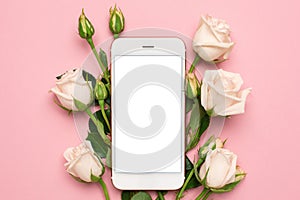 Mobile phone with roses flowers on pink pastel background, women technology concept