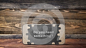 Mobile phone screen view of Jigsaw puzzle piece with text of \'Do you need something