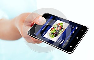 Mobile phone with takeaway restaurant order screen isolated over