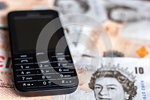 Mobile phone and UK ten pound notes