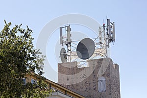 Mobile phones antennas on the roof photo