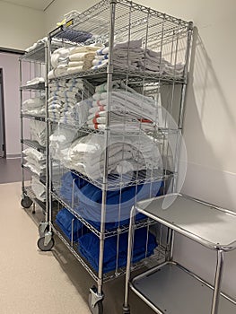A mobile rack with hospital linen