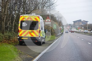 Mobile radar speed safety camera unit parked at the side of a city road