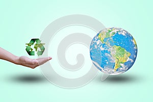 Mobile recycling symbol opens a revealing green leaves. World on a pastel background. color.Environment. concept.Ecology