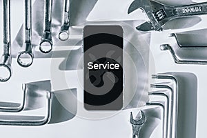 Mobile repair service. Technician workplace with phone and special repairing tools. Electronics repair service, device