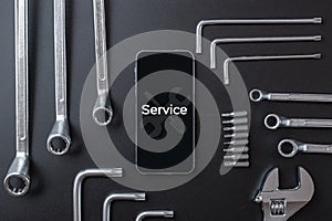 Mobile repair service. Technician workplace with phone and special repairing tools. Electronics repair service, device