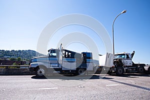 Mobile repair shop on the basis of towing semi truck is repairing faulty semi truck on the road