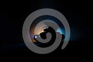 Mobile rocket launch with fire clouds on a dark background. Gloomy Sky at night. Balistic Rockets