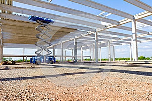 Mobile scaffold, stretched scissor lift platform at construction site