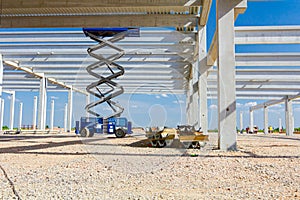 Mobile scaffold, stretched scissor lift platform at construction site