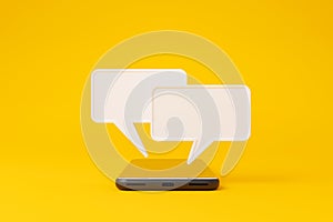 Mobile smartphone and speech bubble chat on yellow background