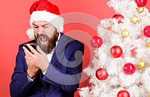 Mobile tariff roaming. Man bearded face wear suit and santa hat hold phone. Congratulate relatives abroad mobile call