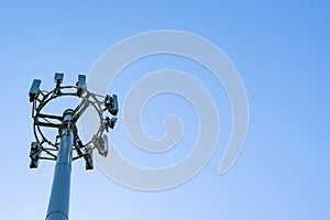 Mobile telecome cell tower on blue sky background