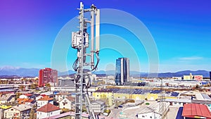 Mobile telecommunication cellular radio network antennas on a mast on the roof