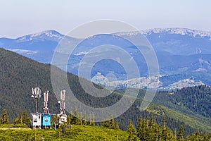 Mobile telecommunication tower or cell tower with antenna and electronic communications equipment in carpathian mountains