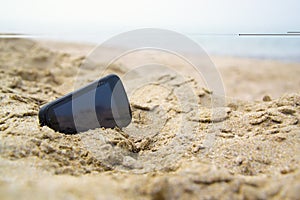 Mobile touch phone in sand on beach