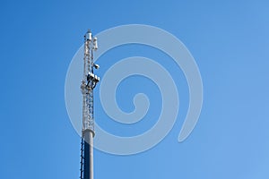 A mobile tower against a blue clear sky
