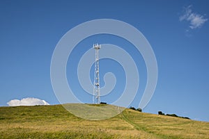 Mobile transmitter on a green hill