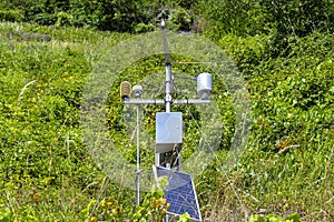 Mobile weather station with solar panel placed on a hill in wineries to monitor atmospheric conditions.