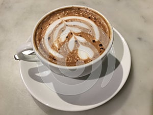 Mocaccono. Mocha. Chocolate cafe. latte art. Close up. photo