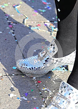 moccasin shoes made with very bright glittering mirrors on the  feet during the carnival party