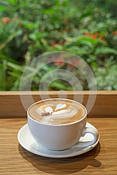 Mocha CaffÃ© latte on wooden table photo