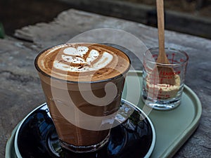 Mocha coffee on wooden table background photo