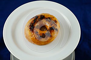 Mochaccino Donut or mocha served in plate Isolated on blue background side view of baked breakfast food