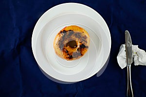 Mochaccino Donut or mocha served in plate Isolated on blue background top view of baked breakfast food