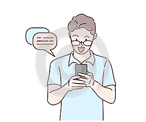 Young man using smartphone. He is chatting through social media