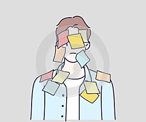 Overworked office worker covered in yellow sticky notes.