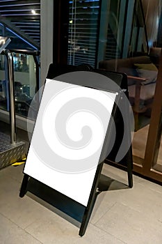 Mock up of blackboard standee sign in front of coffee shop