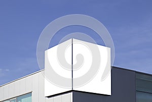 Mock up. Blank billboard outdoors, outdoor advertising on the wall of a building blue sky background