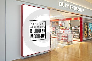 Mock up blank large billboard near entrance of duty free shop photo