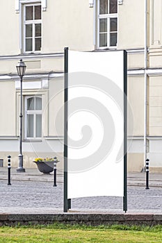 Mock up. Blank outdoor advertising column outdoors, public information board in the street.