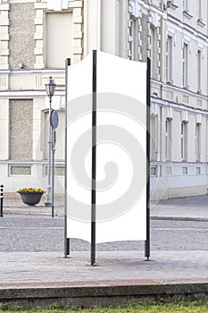 Mock up. Blank outdoor advertising column outdoors, public information board in the street.