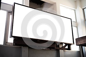 Mock up blank perspective horizontal billboard with clipping path on the wall near entrance in building