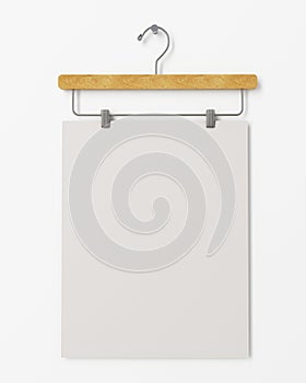 Mock up blank poster on clothes hanger hanging on the white wall, background