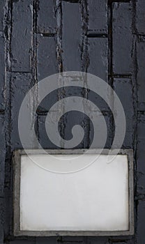 Mock up blank poster picture frame on blue brick wall