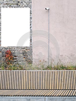 Mock up. Blank vertical billboard, poster frame, advertising board on the wall in city park