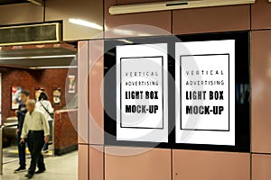 Mock up blank vertical light box at metro station